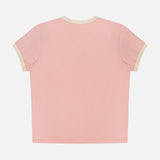 The Lil Goodie Ringer Sangria T-shirt by MOTHER, crafted from a recycled cotton-blend in light pink with cream trim on the collar and cuffs, is shown flat with the back facing up against a white background.