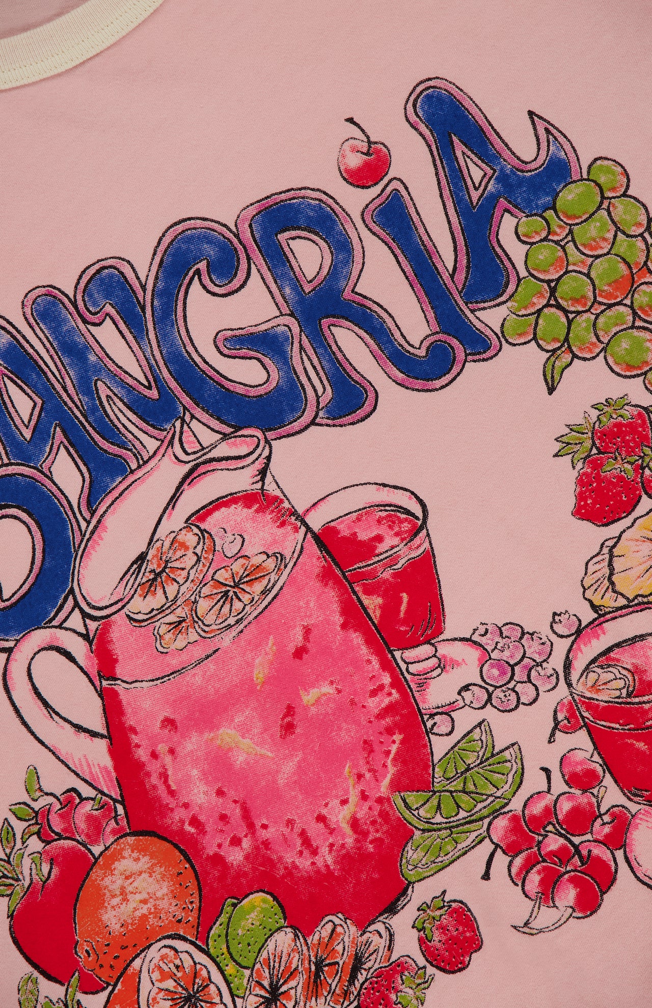 The Lil Goodie Ringer Sangria T-shirt by MOTHER features a bold fruity sangria graphic with oranges, grapes, strawberries, and cherries on pink recycled cotton-blend, plus SANGRIA in large blue letters above.