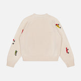 The Raglan Pullover Sweater by MOTHER is a cream 100% cotton crew neck with ribbed cuffs and hem, detailed with colorful cartoon character motifs and fishing lure embroidery on the sleeves and upper back.
