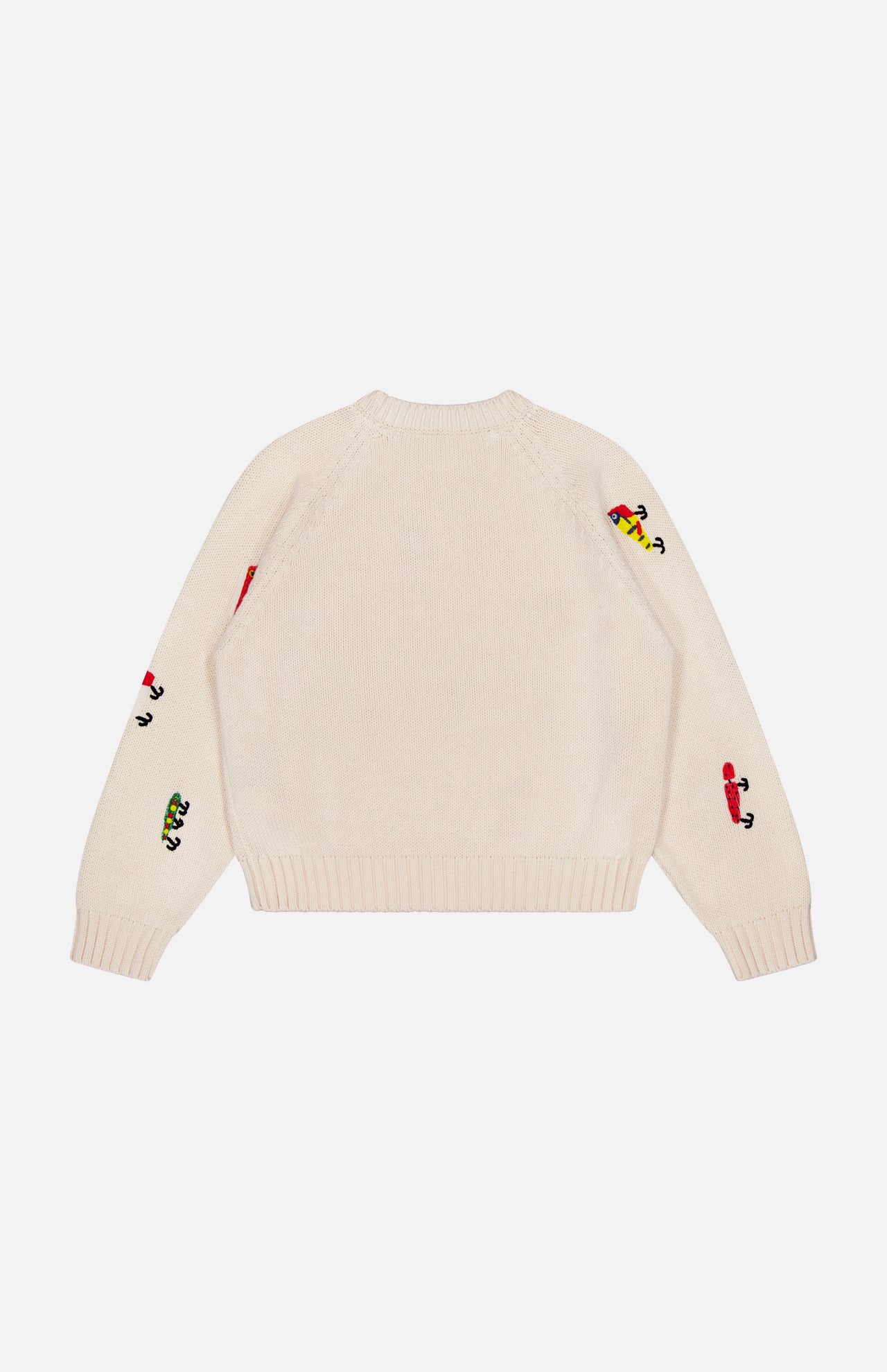The Raglan Pullover Sweater by MOTHER is a cream 100% cotton crew neck with ribbed cuffs and hem, detailed with colorful cartoon character motifs and fishing lure embroidery on the sleeves and upper back.