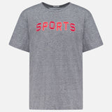 The Rowdy Sports T-Shirt by MOTHER is a grey, oversized crew neck made from heathered cotton-blend. It features bold red "SPORTS" lettering across the chest and is shown on a plain white background.