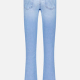 The Runaway Skinny Jean in Derby Doll by MOTHER is shown from the back in a light blue wash, featuring two rear pockets, a fitted mid-rise waist, visible stitching, and a subtle flare at the bottom of each leg.