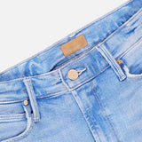 Close-up of the top section of MOTHER's The Runaway Skinny Jean in Derby Doll, highlighting the button, zipper, belt loops, and a brown leather patch on the waistband.