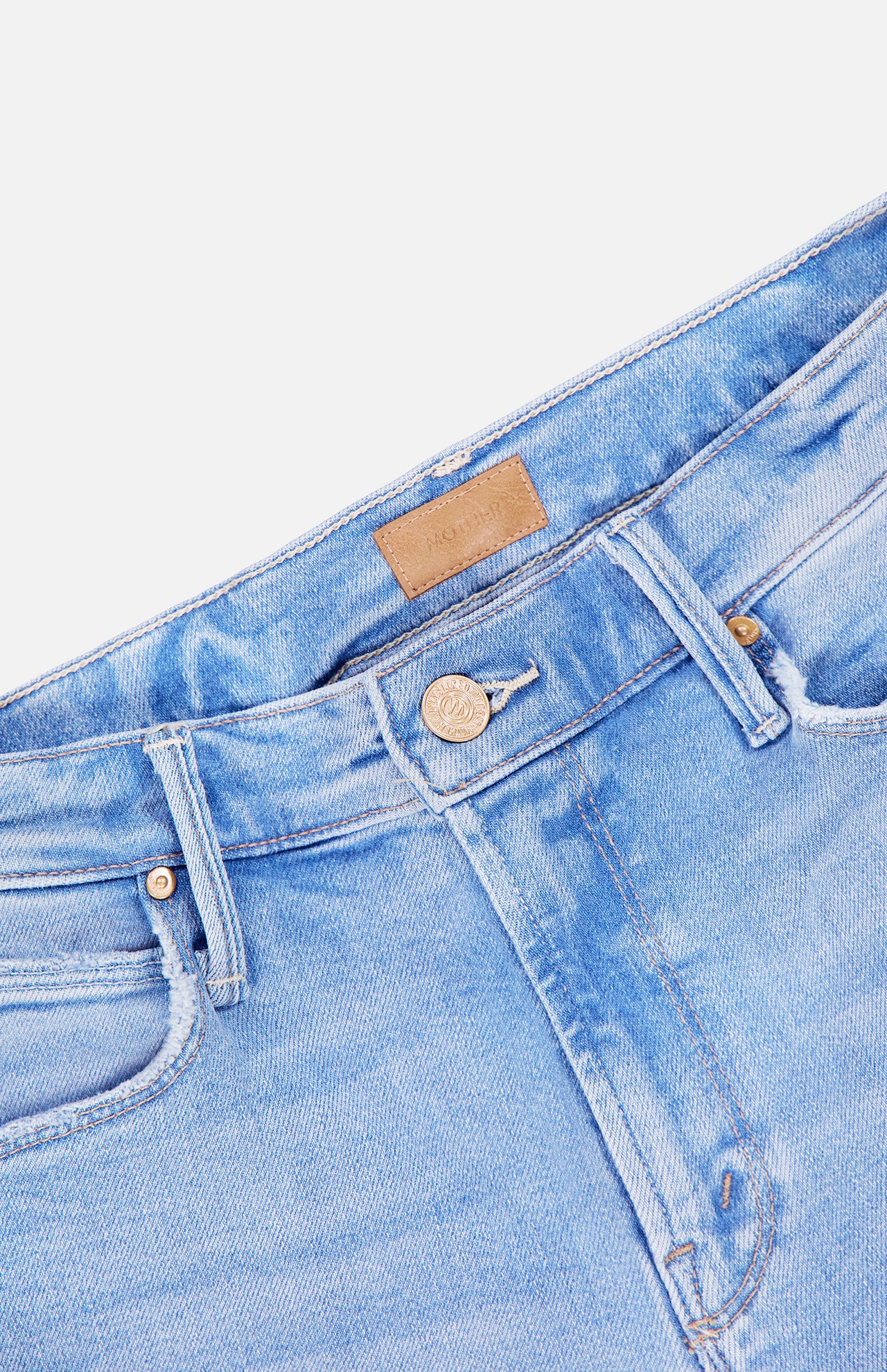 Close-up of the top section of MOTHER's The Runaway Skinny Jean in Derby Doll, highlighting the button, zipper, belt loops, and a brown leather patch on the waistband.