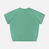 The Short Sleeve Concert Shirt by MOTHER is a green, loose-fit raglan sweatshirt with short sleeves and crew neck, shown from the back on a plain white background. Made from 100% cotton, it features no visible patterns or logos.