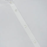 Nili Lotan Elio Ruffle Detail Shirt, a tailored white blouse with a ruffled collar.