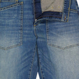 Nili Lotan Shon Jean in Classic Wash: mid-rise, bow-leg blue denim jeans featuring a zip fly and large patch pockets on the front.