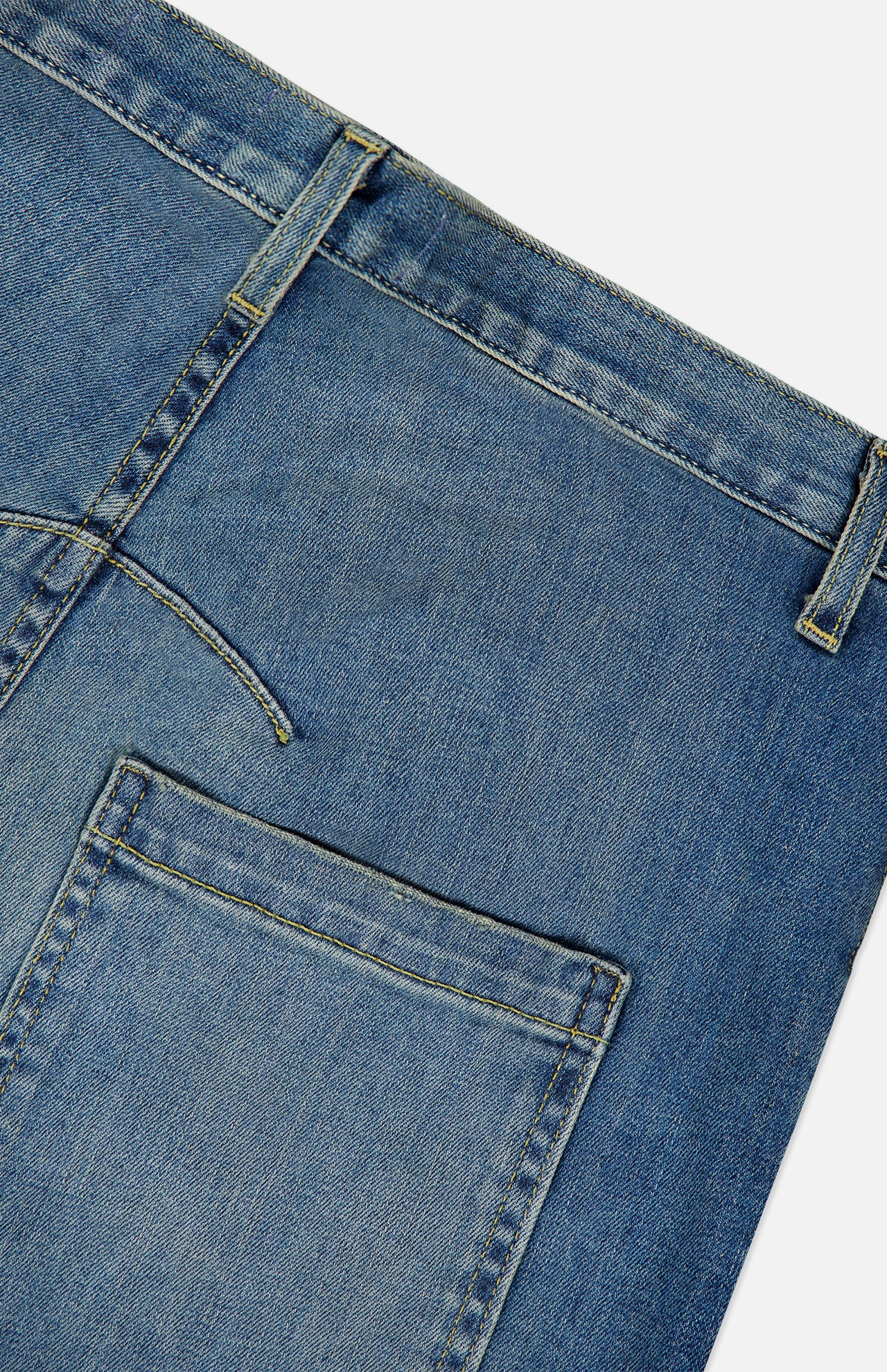 Close-up of the back waistband and pocket of the Nili Lotan Shon Jean in Classic Wash.