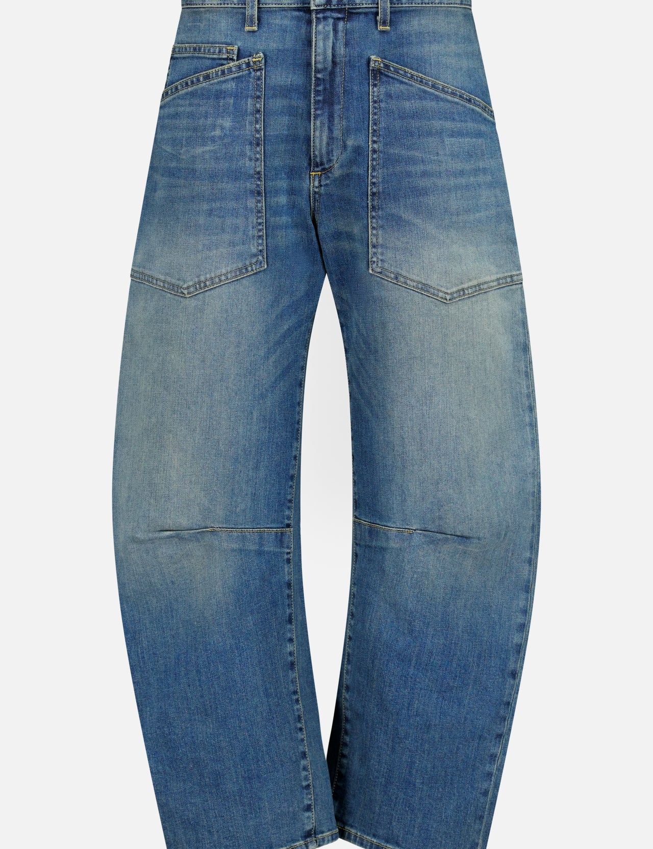 Nili Lotan Shon Jean in Classic Wash: mid-rise blue jeans with a curved, wide-leg bow leg silhouette and two large patch pockets on the front.