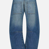 Back view of the Nili Lotan Shon Jean in Classic Wash, featuring mid-rise, wide-leg blue jeans with large square patch pockets on the seat and horizontal seam detailing above the knees.