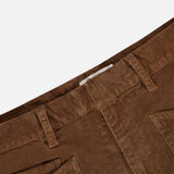 Close-up of the waistband and front pockets of hazelnut Nili Lotan Shon Stretch Corduroy Bow Leg Pant mid-rise stretch corduroy pants.