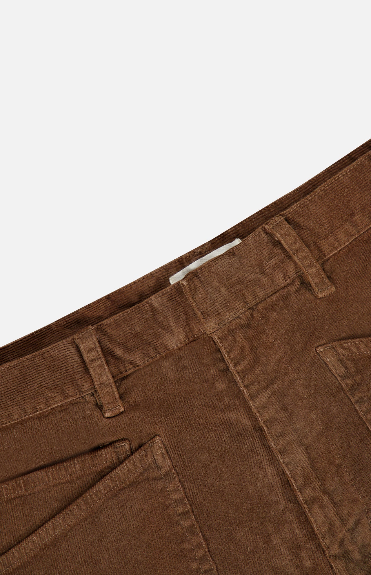 Close-up of the waistband and front pockets of hazelnut Nili Lotan Shon Stretch Corduroy Bow Leg Pant mid-rise stretch corduroy pants.