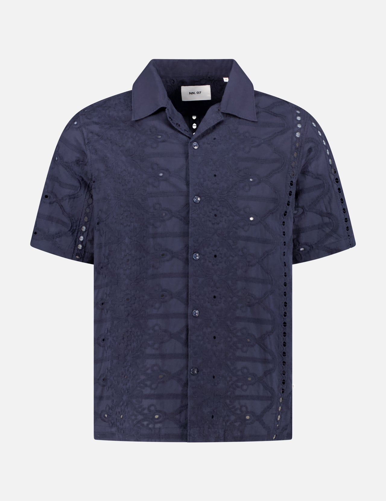 The NN07 Julio Embroidered Shirt is a short-sleeved, dark navy collared top with subtle patterns and lightweight, slightly sheer panels inspired by classic cotton Anglaise embroidery—a modern-casual staple.