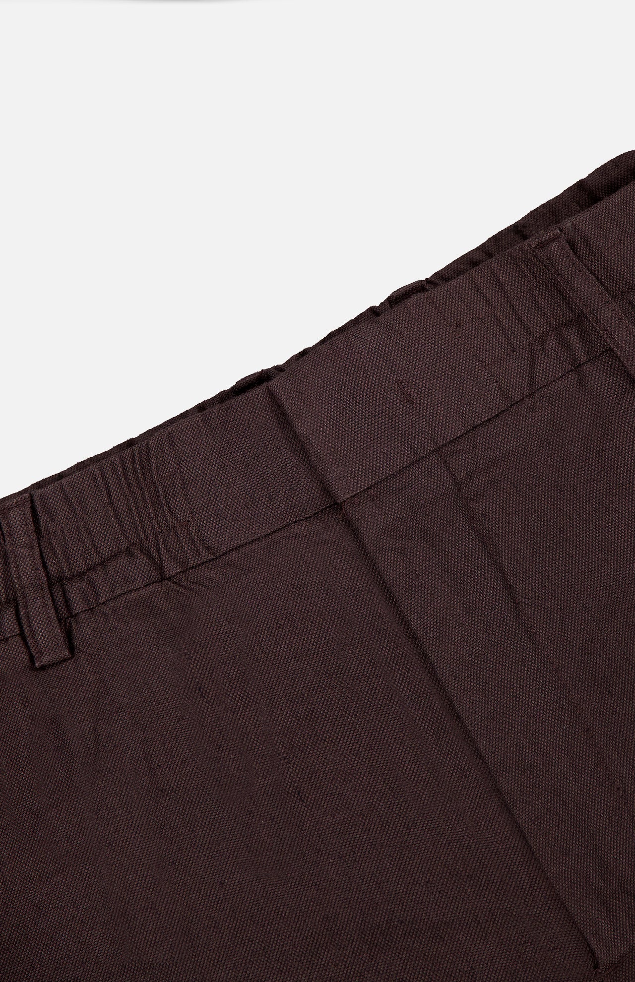 Close-up of the waistband and upper section of the NN07 Billie Drawstring Shorts in dark brown, highlighting belt loops and seam details against a plain background—crafted from a comfortable linen viscose blend.