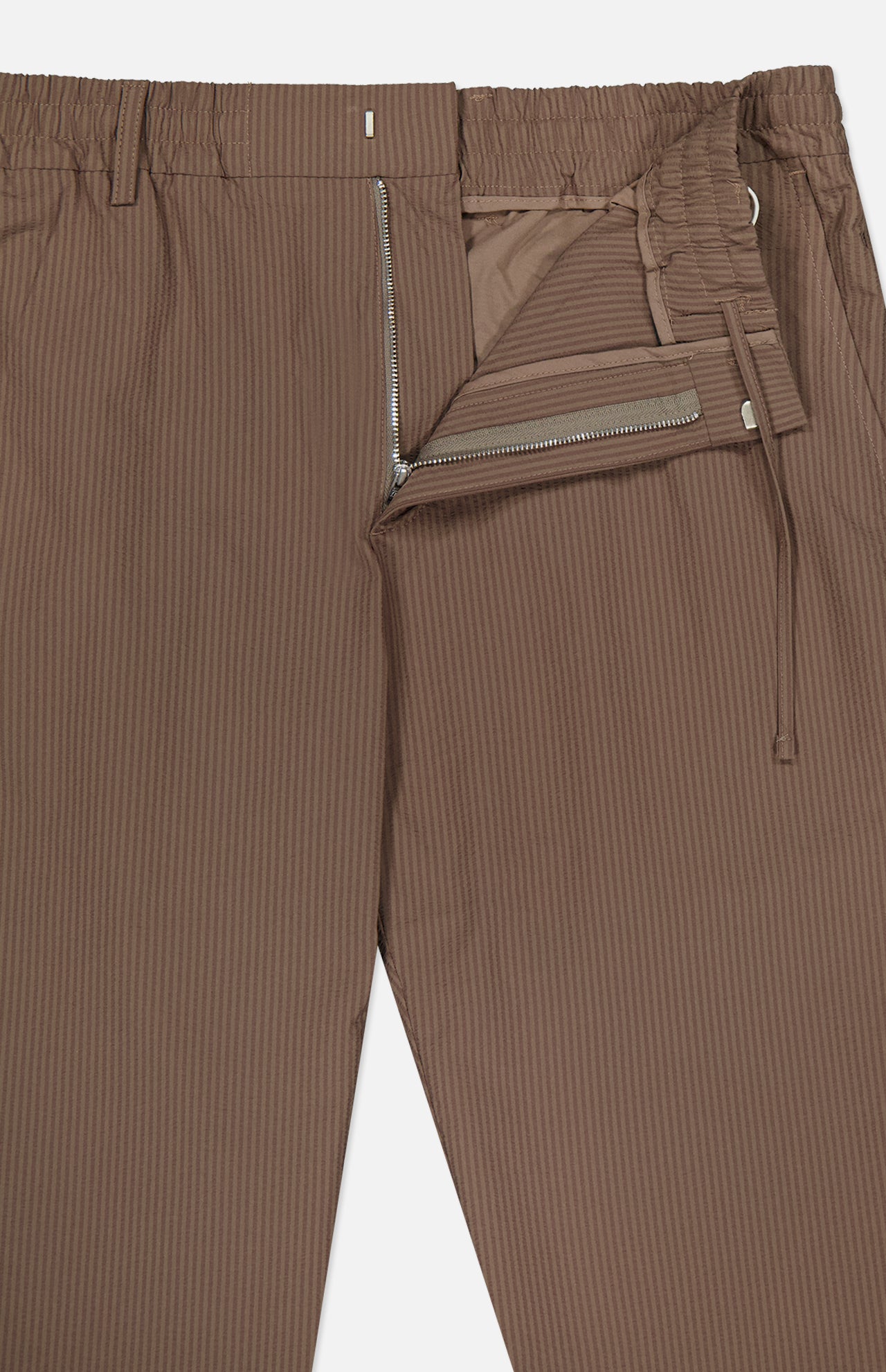 The NN07 Billie Seersucker Trouser Pant features a brown pinstriped seersucker fabric, elasticated waistband, zipper fly, inner button closure, and drawstring detail with subtle vertical stripes.