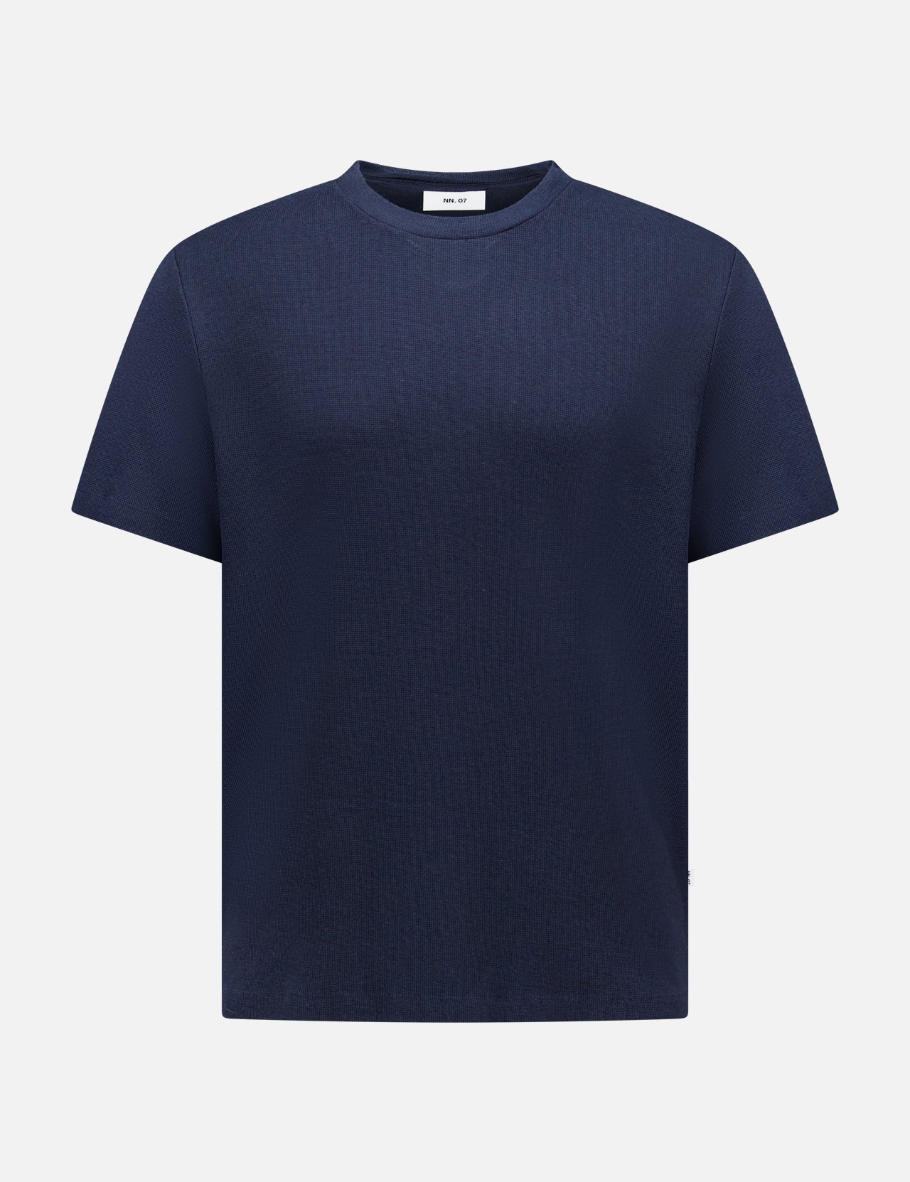 The NN07 Clive Waffle T-Shirt is a short-sleeve, crew neck navy blue top with a waffle-knit design—an essential addition to any modern-casual wardrobe, shown here against a white background.