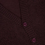 Close-up of the NN07 Fleece Cardigan Sweater in dark burgundy, featuring pure wool construction, ribbed edges, matching buttons, and a white collar label—an elegant upgrade for any modern-casual wardrobe.