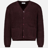 Crafted from pure wool for a premium feel, the NN07 Fleece Cardigan Sweater features a rich burgundy hue with a V-neck, button front closure, two front pockets, and ribbed cuffs and hem—perfect for adding warmth and texture to your modern-casual wardrobe. Shown here against a plain white background.