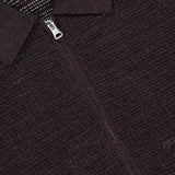 Close-up of the Gustav Long Sleeve Zip Sweater by NN07 in textured dark brown, featuring a collar and full front zip. Inside the collar, a white NN07 label is visible.