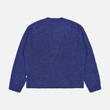 The Jim Crew Neck Knitted Sweater by NN07 is presented laid flat with the back facing up against a plain white background. Crafted from a wool-blend jersey knit in bright blue, it features long sleeves and a relaxed fit, finished with ribbed cuffs and hem.