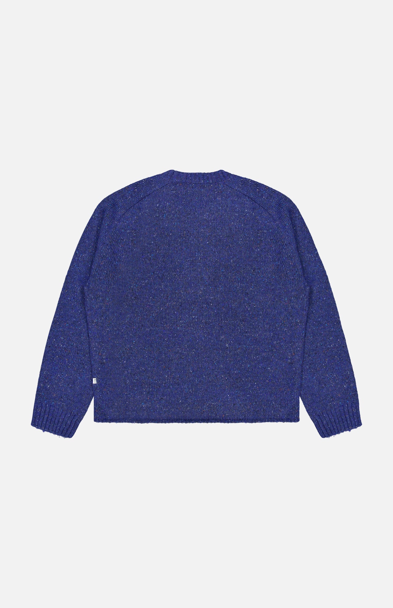 The Jim Crew Neck Knitted Sweater by NN07 is presented laid flat with the back facing up against a plain white background. Crafted from a wool-blend jersey knit in bright blue, it features long sleeves and a relaxed fit, finished with ribbed cuffs and hem.