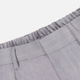 Close-up of the waistband of the NN07 Kay Striped Linen Trouser Pant in light gray with subtle pinstripes, featuring a relaxed fit, elasticized back, belt loops, and stitched front pleats for modern comfort.