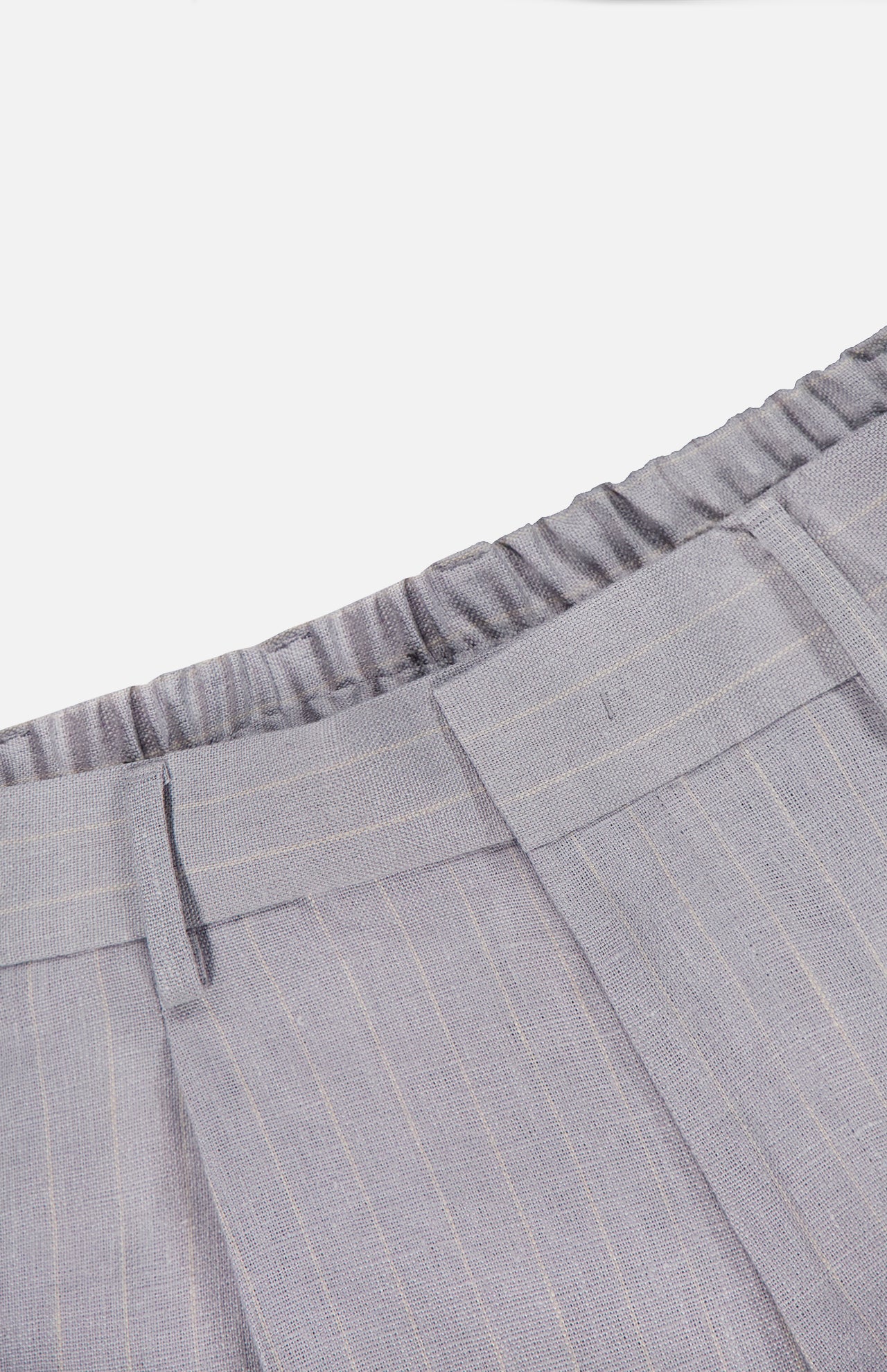 Close-up of the waistband of the NN07 Kay Striped Linen Trouser Pant in light gray with subtle pinstripes, featuring a relaxed fit, elasticized back, belt loops, and stitched front pleats for modern comfort.
