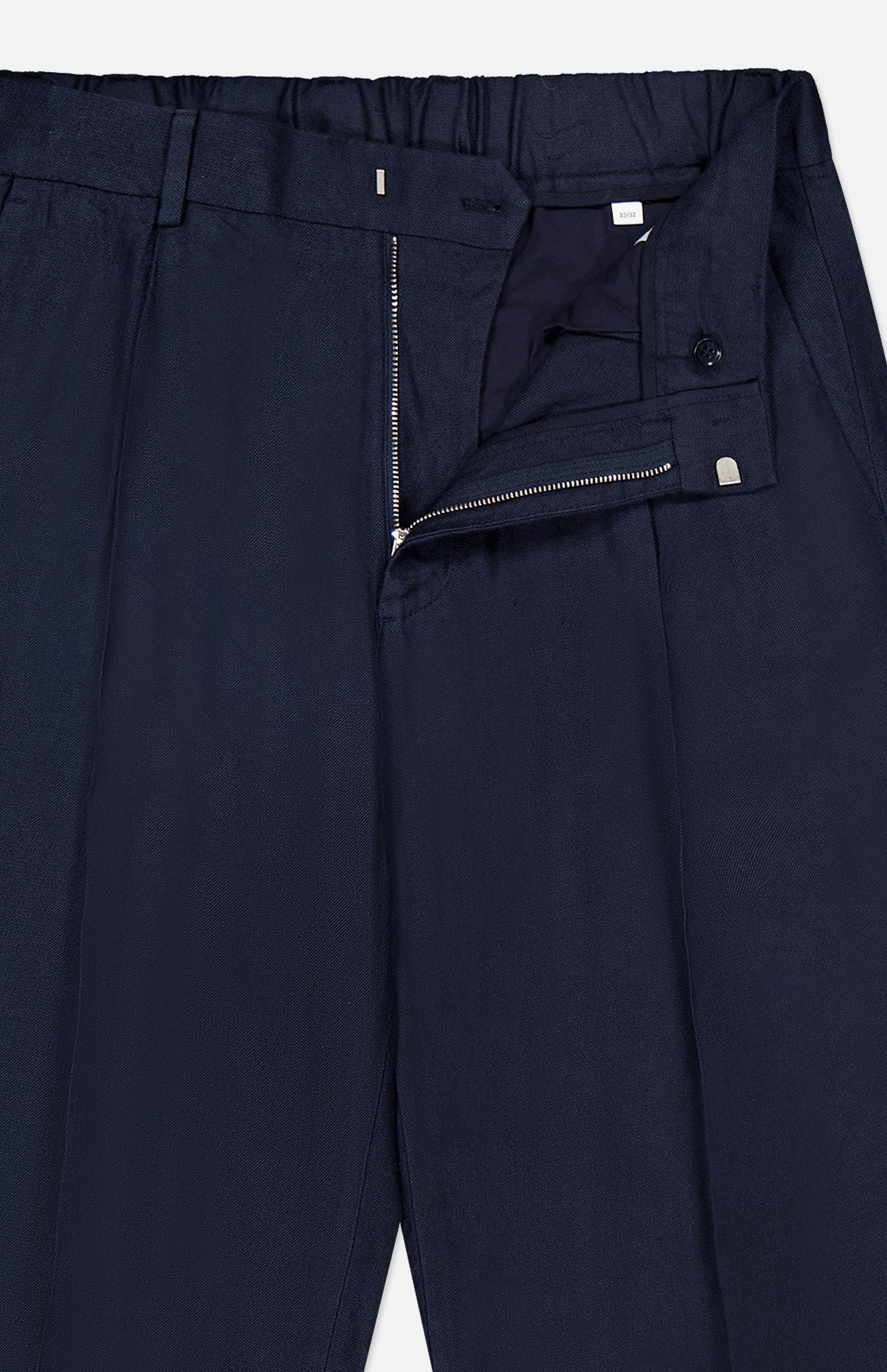 The Kay Relaxed-fit Trouser Pant by NN07 in navy blue features a relaxed fit with a partially open zipper and clasp waistband, showcasing the top front and waistband details against a white background.
