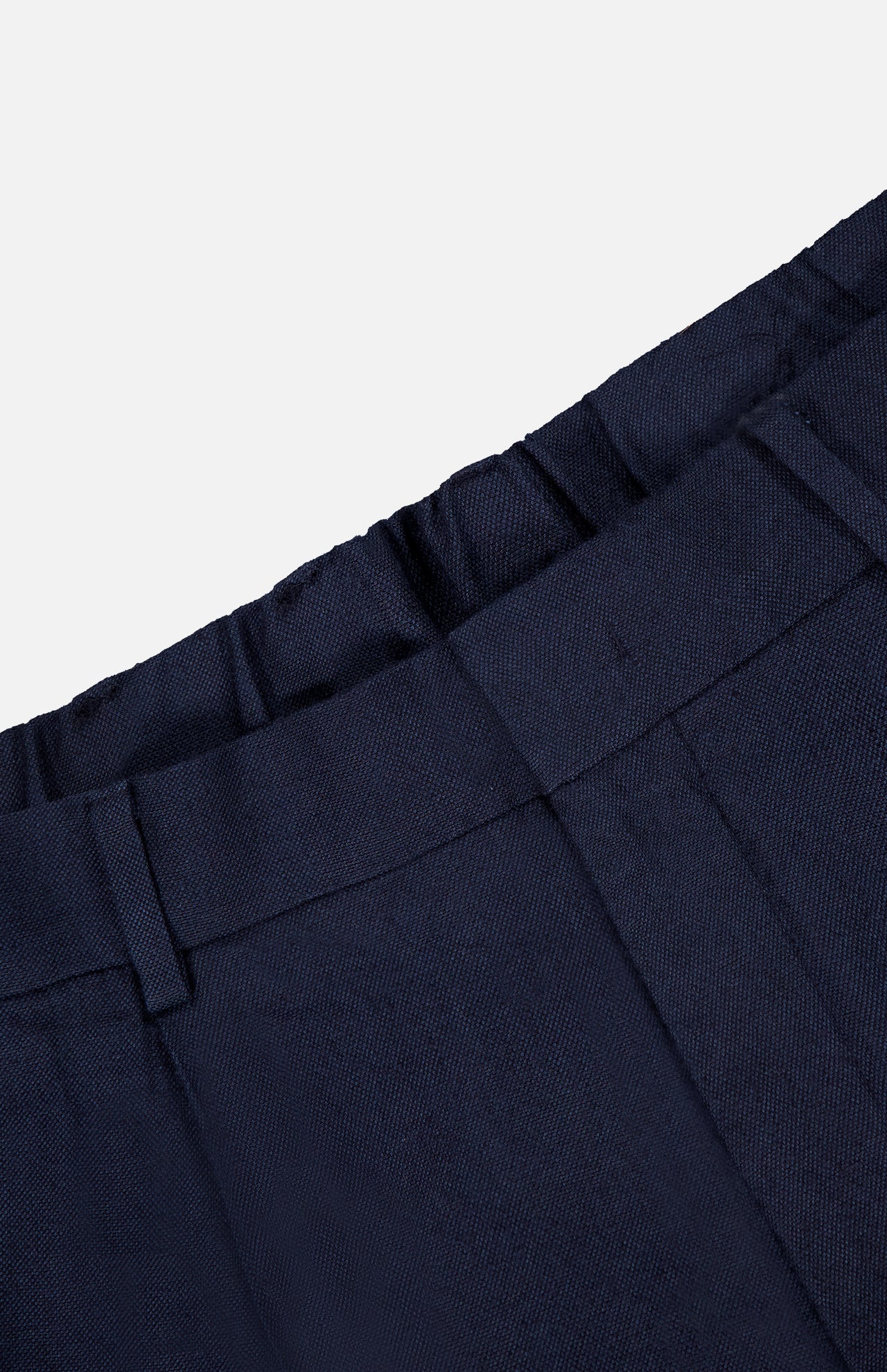 Close-up of the waistband and upper section of the NN07 Kay Relaxed-fit Trouser Pant in dark navy, highlighting belt loops, a front seam, and part of the waistband against a plain light background.