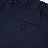 Close-up of NN07’s Kay Relaxed-fit Trouser Pant in navy, featuring an elastic waistband, a single buttoned welt back pocket, and subtly textured fabric for a modern look.