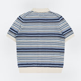 The NN07 Nolan Polo Short Sleeve Cardigan Sweater features blue knit with navy and white stripes, cream collar, hem, and cuffs. Made from 100% cotton for a modern-casual look. Shown flat on a white background.