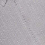 Close-up of the NN07 Petrus Striped Linen Jacket in light grey pinstripe, featuring partially visible zipper near the collar, subtle texture, and visible stitching for an oversized silhouette.