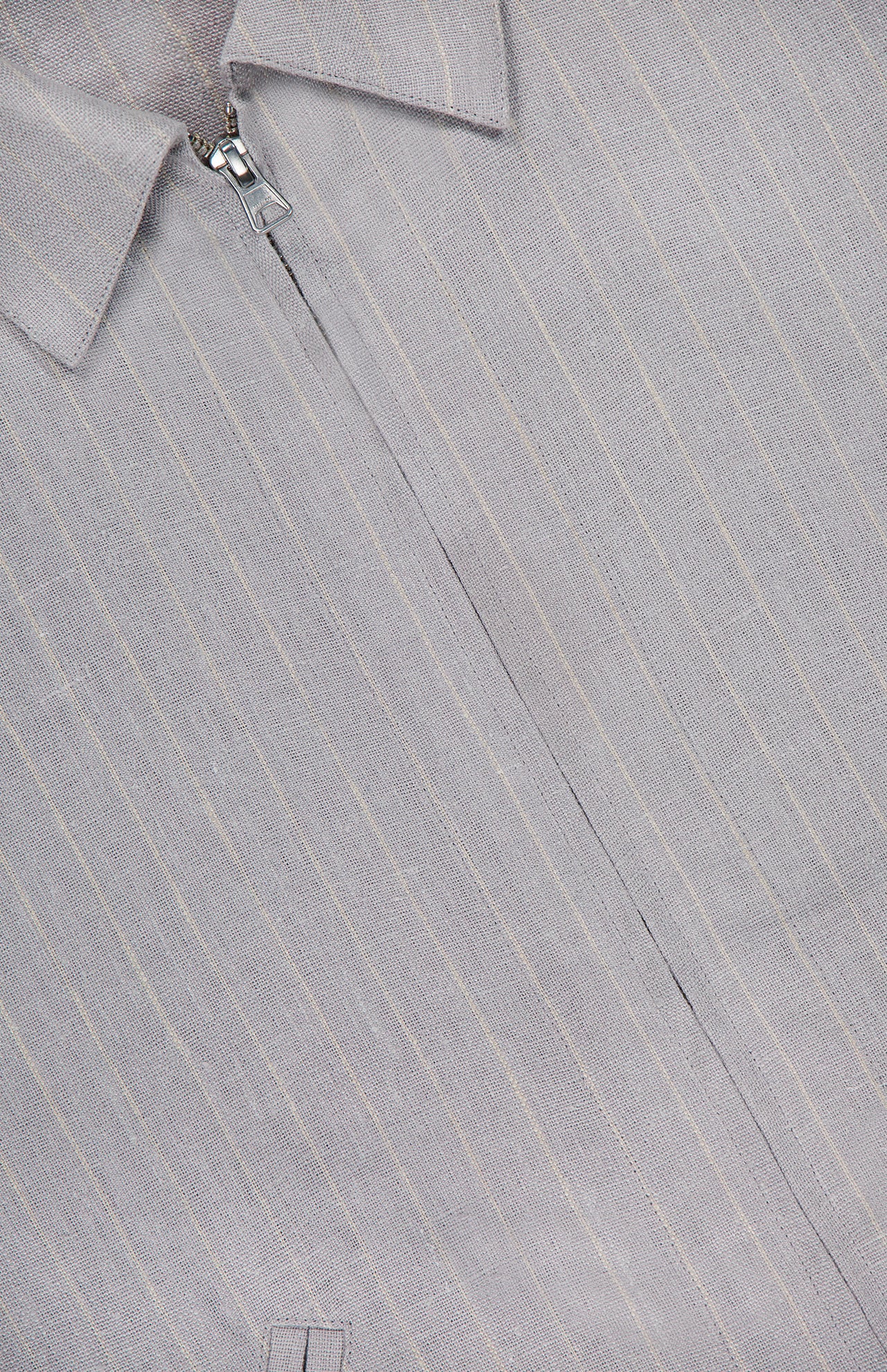 Close-up of the NN07 Petrus Striped Linen Jacket in light grey pinstripe, featuring partially visible zipper near the collar, subtle texture, and visible stitching for an oversized silhouette.