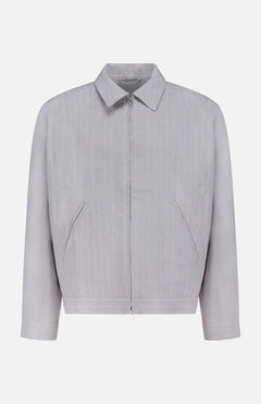 The NN07 Petrus Striped Linen Jacket is a light grey, long-sleeve European linen jacket with vertical pinstripes, front zipper, two angled pockets, classic collar, and straight cuffs, shown on a plain white background.