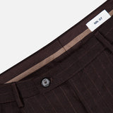 Close-up of the waistband and button closure of the brown pinstripe Robin Pinstripe Trouser Pant.