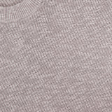 Close-up of the Russell Crewneck Sweater by NN07 in light gray, featuring bouclé-inspired textured fabric and a white NN07 label—an elevated, modern-casual essential.