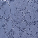 Close-up of the NN07 Ryan Flower Design Short Sleeve Shirt featuring a subtle, textured mesh pattern and a white NN07 label near the collar.