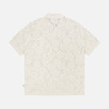 Back view of the NN07 Ryan Flower Design Short Sleeve Shirt in ivory, featuring a flower jacquard pattern and flat collar, shown on a plain white background.