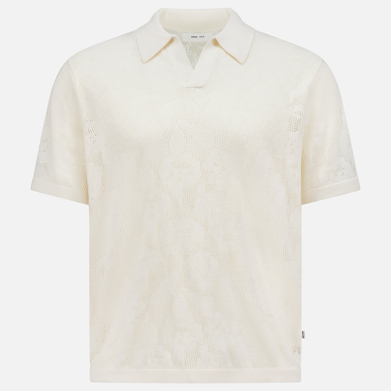 The NN07 Ryan Flower Design Short Sleeve Shirt is an ivory organic cotton polo with a subtle flower jacquard pattern, classic collar, and relaxed fit, shown against a plain white background.