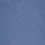 A close-up of the NN07 Ted Linen Crewneck Sweater in light blue highlights its ribbed collar and soft linen texture. A white NN07 label is partially visible near the neckline of this breathable men's pullover.