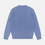 The NN07 Ted Linen Crewneck Sweater is shown from the back in light blue. This men's long sleeve pullover offers breathable comfort and everyday style against a white background.