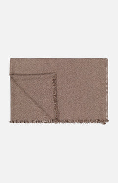 The Theo Throw Blanket by ALONPI is a folded brown luxury throw featuring a subtle herringbone pattern and fringed edges, made in Italy, displayed on a plain white background.