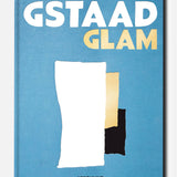 Book cover titled Gstaad Glam by ASSOULINE features abstract white, beige, and black shapes against a blue background, capturing the sophisticated allure of this luxury resort in the Swiss Alps. The publisher’s name, ASSOULINE, appears at the bottom.