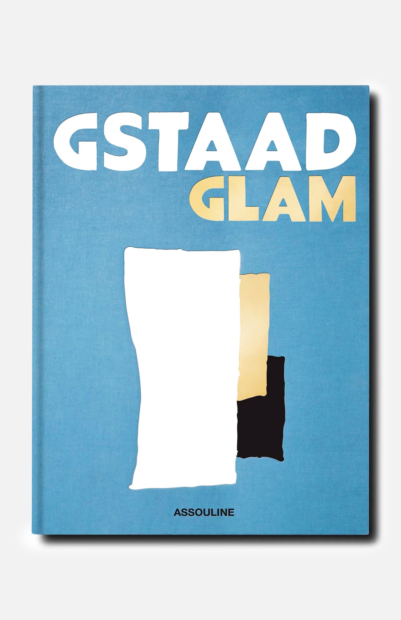 Book cover titled Gstaad Glam by ASSOULINE features abstract white, beige, and black shapes against a blue background, capturing the sophisticated allure of this luxury resort in the Swiss Alps. The publisher’s name, ASSOULINE, appears at the bottom.