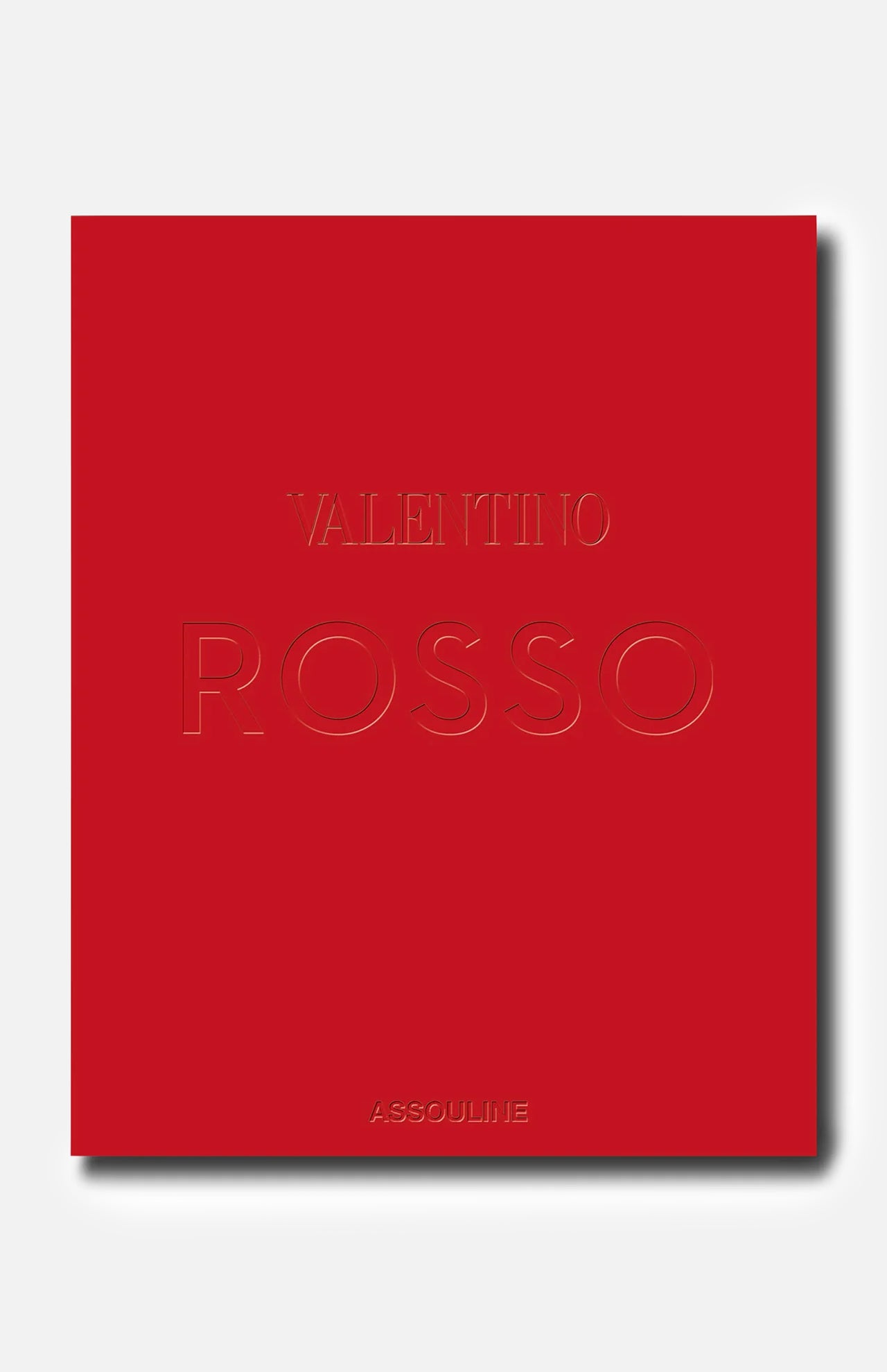 A bold red book cover featuring the embossed title “Valentino Rosso” at its center and the brand name “ASSOULINE” at the bottom, celebrating the timeless elegance and enduring legacy of Rosso Valentino in haute couture. The background is light gray.