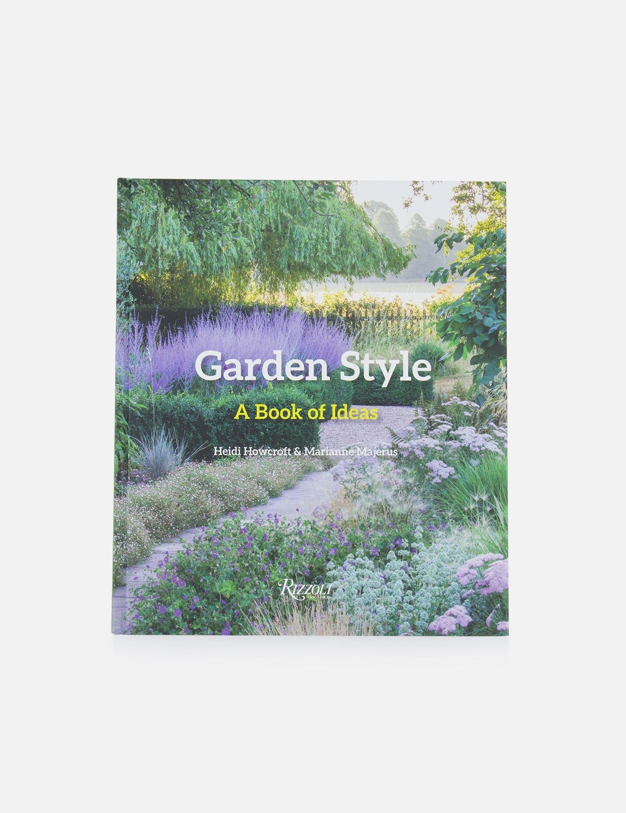 The RIZZOLI book "Garden Style" features a lush garden scene on its cover, with pathways, lavender, and greenery—offering planting inspiration and fresh garden design ideas.