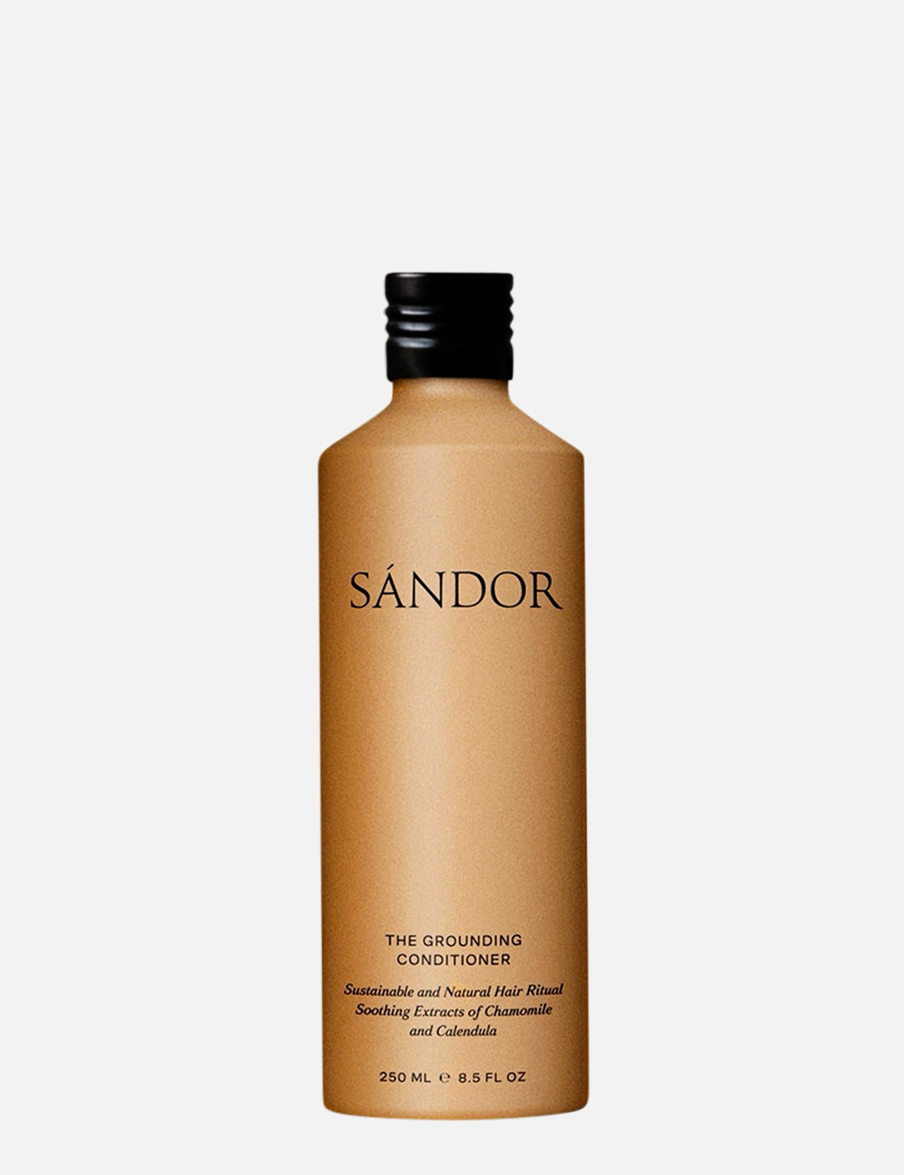 A tan bottle of SÁNDOR The Grounding Conditioner, a unisex formula with organic aloe vera, displays minimalist black text highlighting chamomile and calendula extracts, set against a plain white background.