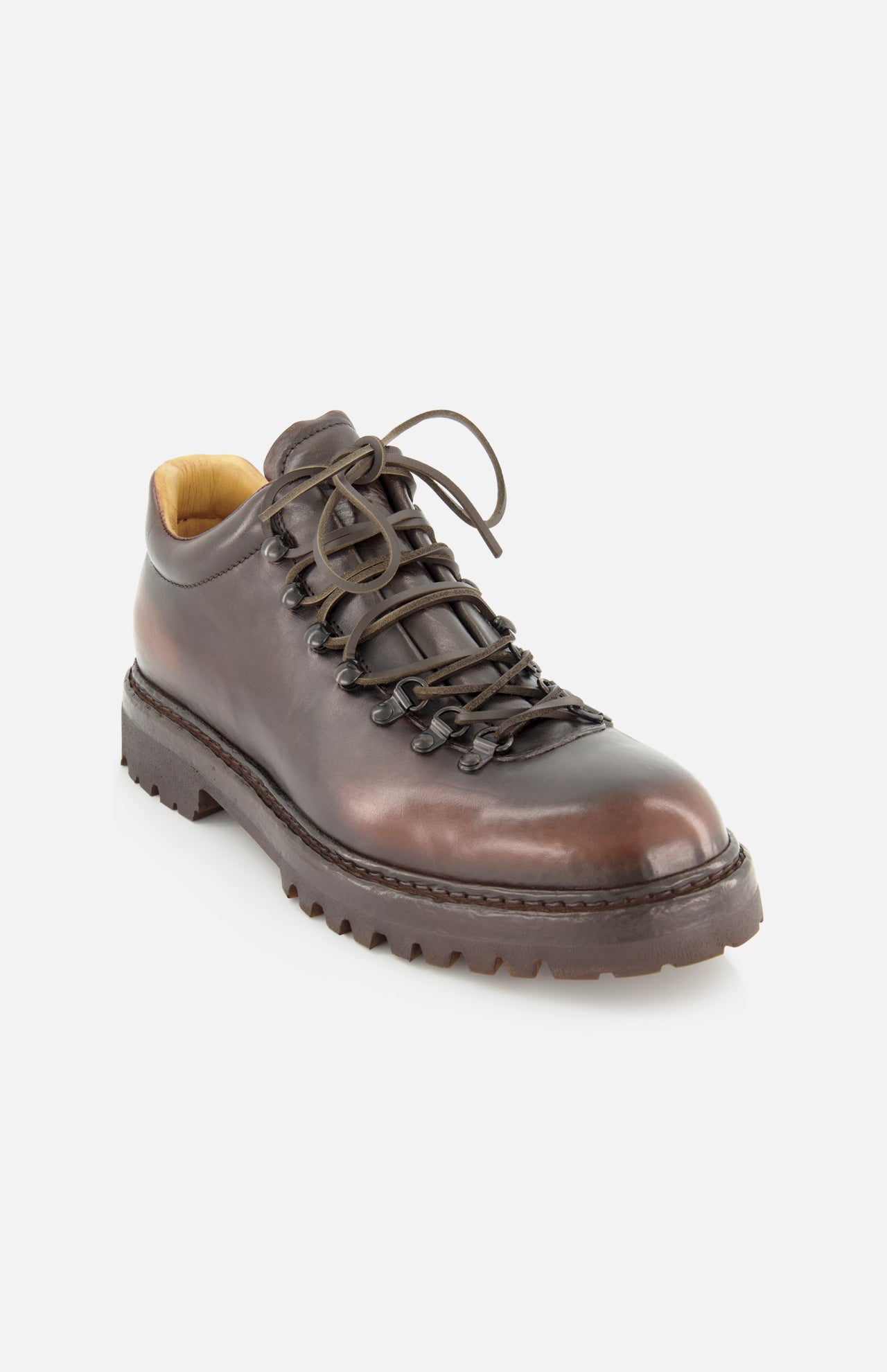 The OFFICINE CREATIVE Artik Flex Lace Low Boot—a single brown leather hiking shoe featuring black laces, metal eyelets, and a thick, rugged sole inspired by vintage lace-up boots—displayed against a white background.
