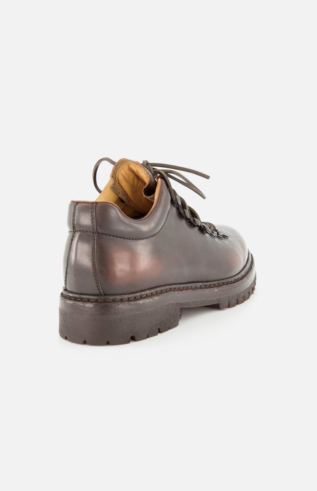 The OFFICINE CREATIVE Artik Flex Lace Low Boot is a brown airbrushed leather boot featuring a thick, rugged sole and tan interior, expertly handcrafted in Italy. Shown from the back left angle against a plain white background.