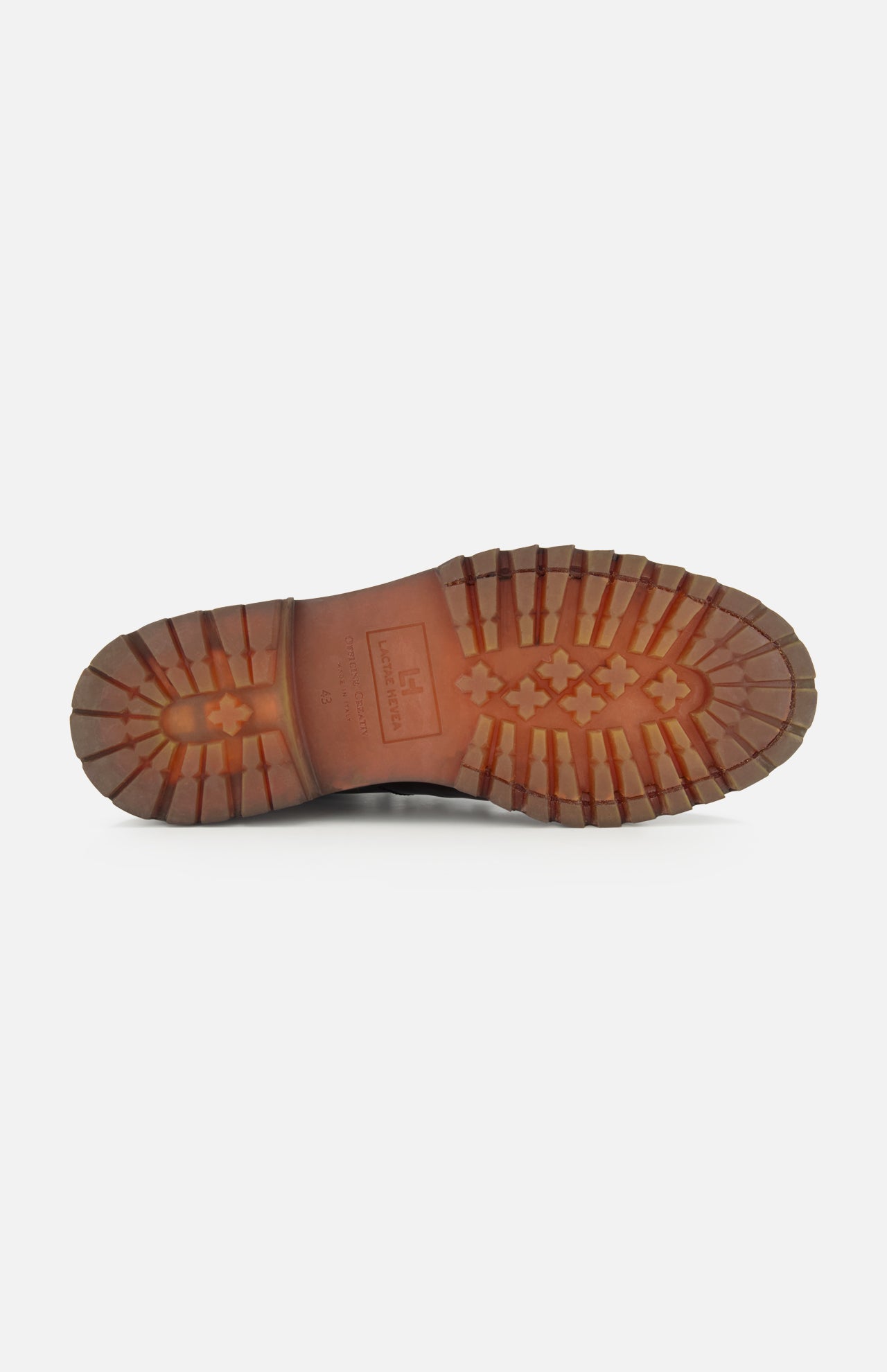 The image shows the sole of the OFFICINE CREATIVE Artik Flex Lace Low Boot, handcrafted in Italy, with a rugged tread pattern and a logo at the arch, photographed on a white background.